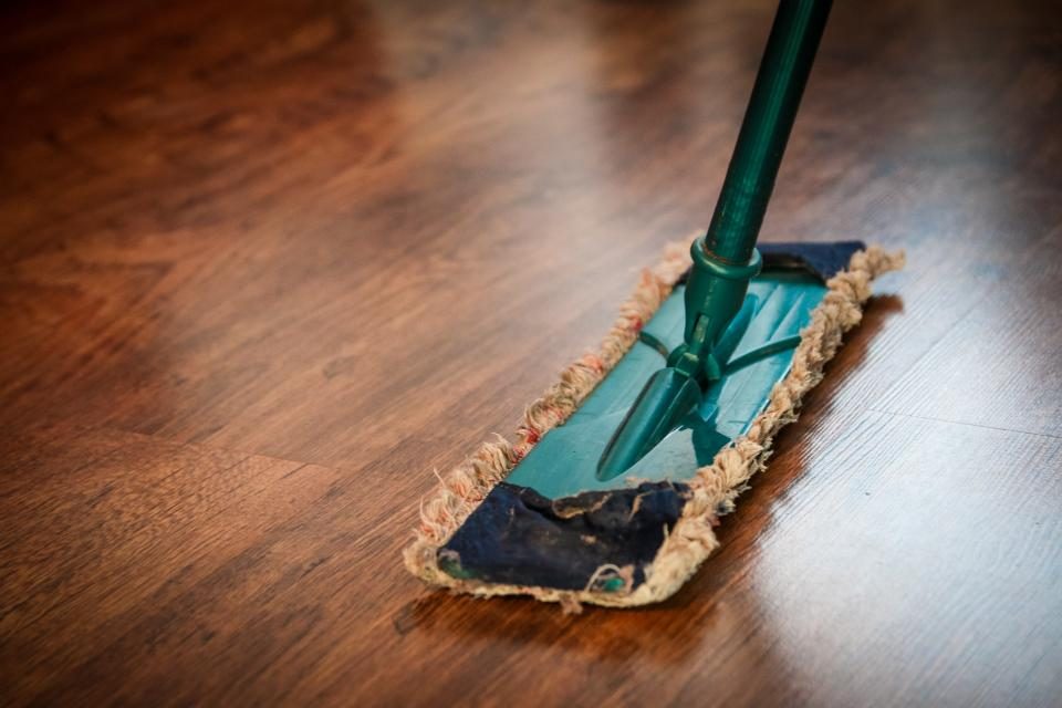 Mop cleaning a hard venue floor