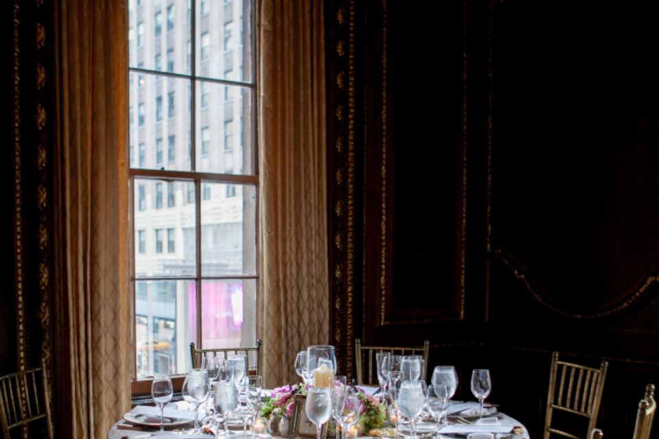 Indoor dining area with tables and chairs set for guests