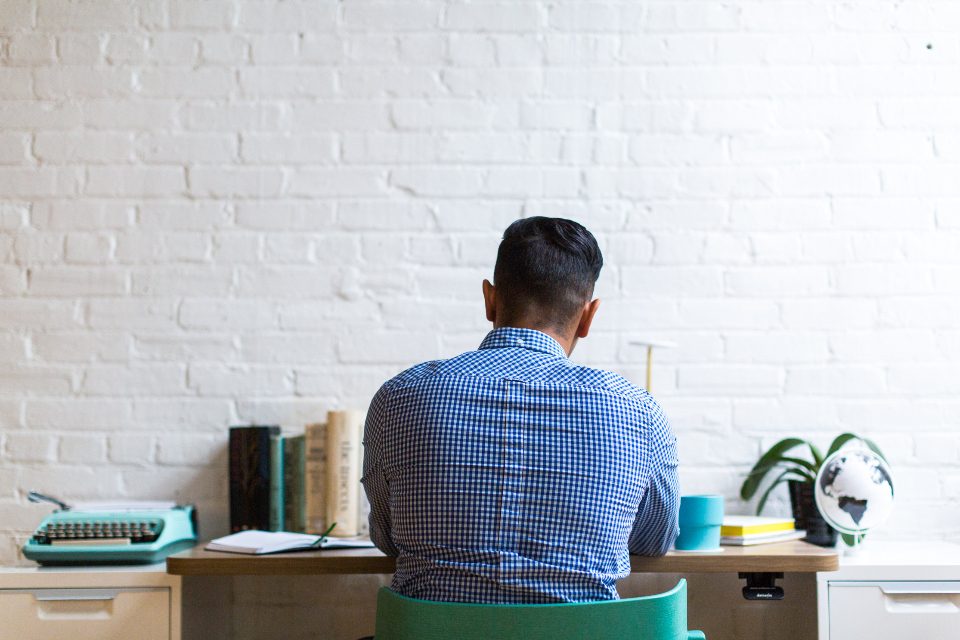 Tidy office desk and workstation in a bright open workspace